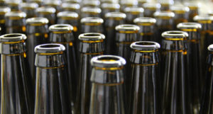 beer-chronicle-houston-craft-beer-review-what-is-skunked-beer-rows-of-brown-bottles-lined-up