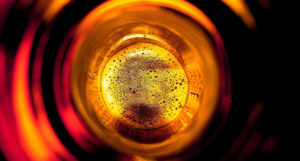 beer-chronicle-houston-craft-beer-review-what-is-skunked-beer-loking-down-into-brown-bottle-suds