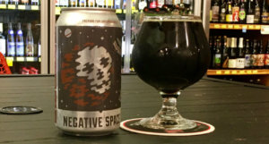 beer-chronicle-houston-craft-beer-review-11-below-negative-space-can-next-to-full-snifter-glass