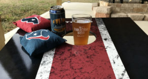 Beer-Chronicle-Houston-Craft-Beer-Review-Boomtown-Blonde-on-cornhole-board