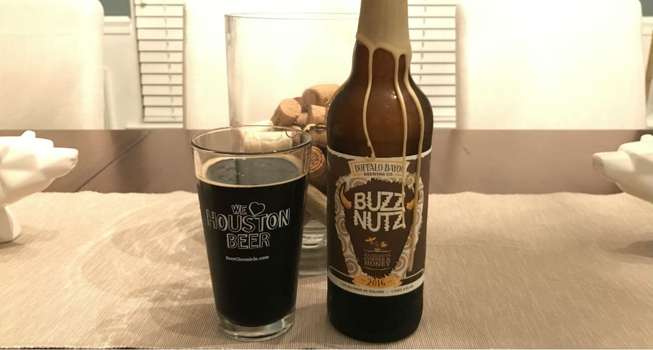 beer-chronicle-houston-craft-beer-review-buzz-nutz-beer-with-bottle-on-wooden-table