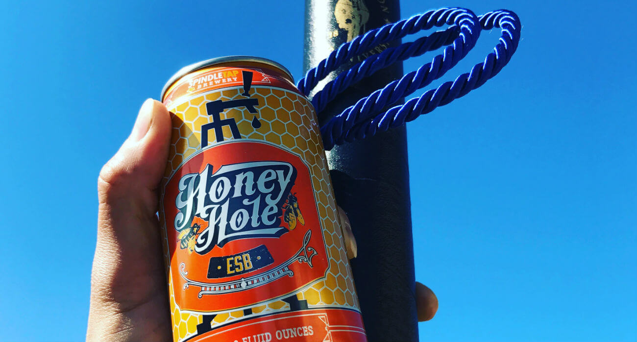 beer-chronicle-houston-craft-beer-review-honey-hole-beer-can-next-to-diploma-holder-and-blue-honors-cord