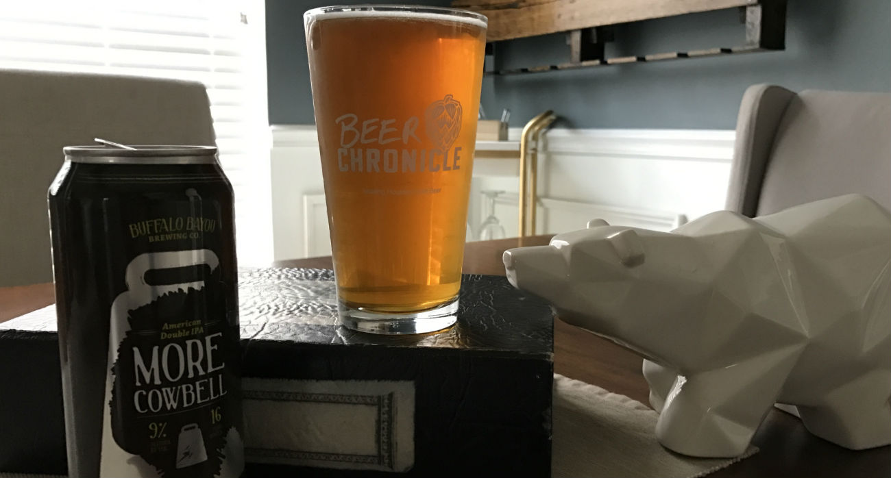 Beer-Chronicle-Houston-Craft-Beer-Review-More-Cowbell-Beer-Next-To-Can-On-Book