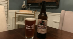 beer-chronicle-houston-craft-beer-review-ryed-hard-beer-in-pint-glass-next-to-bottle-on-wooden-table