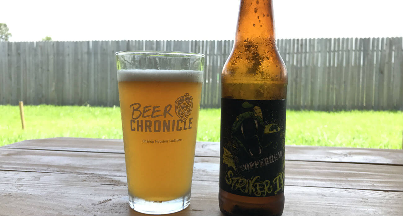 Beer-Chronicle-Houston-Craft-Beer-Review-Striker-IPA-Beer-In-Pint-Glass-Next-To-Beer-Bottle