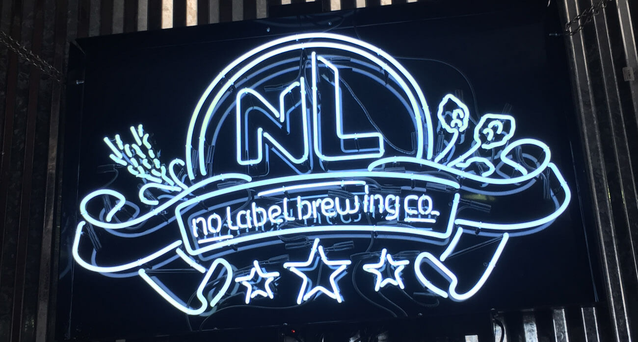 Beer-Chronicle-Houston-Craft-Beer-no-label-sitting-sidehaze-mango-milkshake-NEIPA-neon-sign
