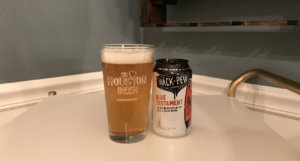 Houston-Beer-Chronicle-Craft-Beer-Review-Blue-Testament-Beer-In-Pint-Glass-Next-To-Can
