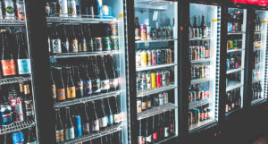 diverse-beer-cooler-well-lit-displaying-colorful-bottles-and-cans-beer-chronicle-houston-best-beer-bars-to-visit-in-houston_0002_justin-sanchez-PoAC9dCnofk-unsplash